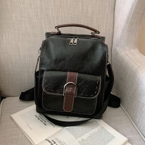 Liten vintage ryggsäck i konstläder - Svart - Handväska i läder