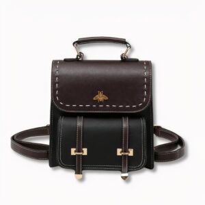 Sac à dos cartable noir pour femme avec un motif d'abeille sur le devant, sur fond gris clair